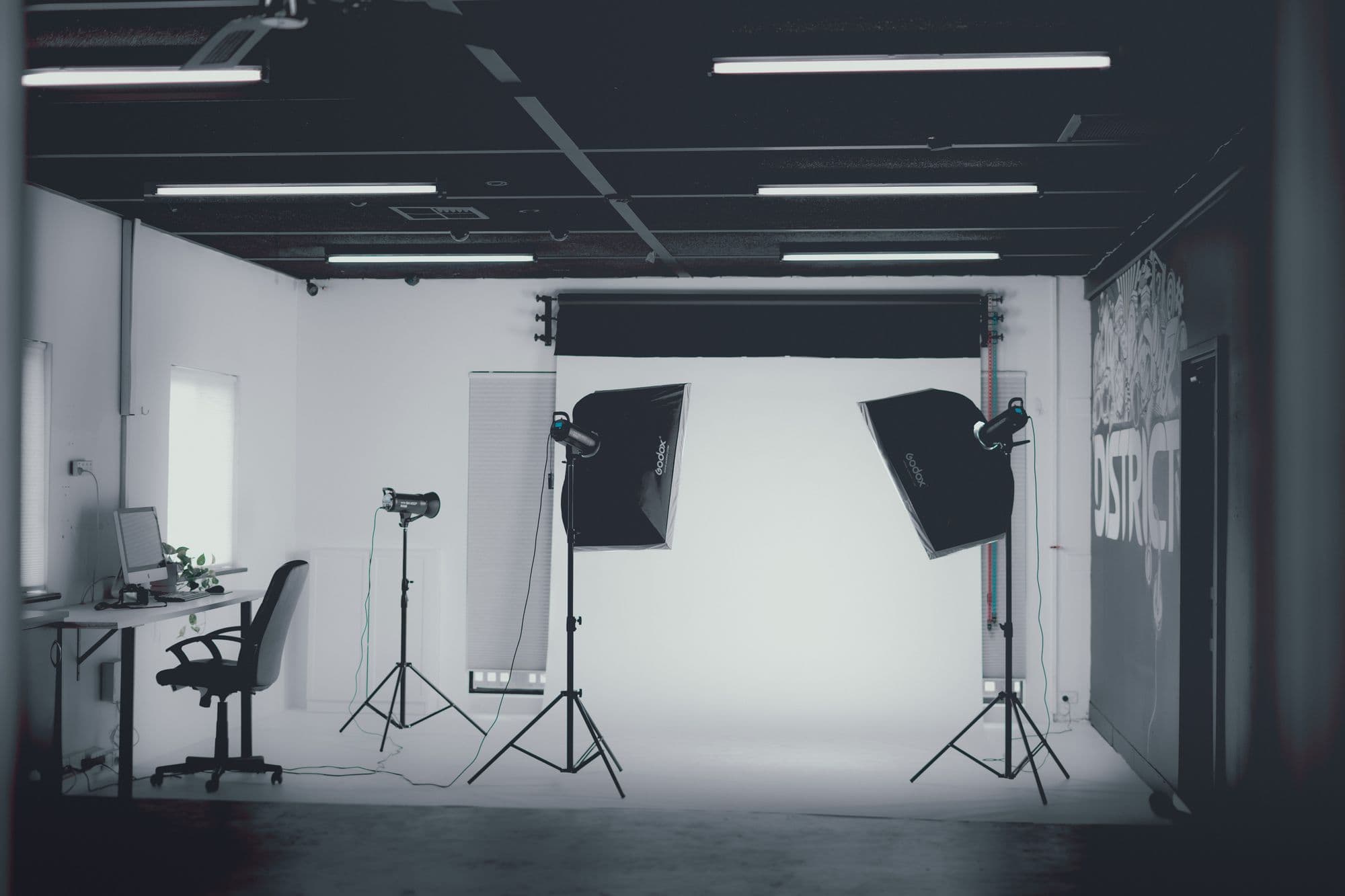 The Northlight studio — softboxes and a white cyc wall in black and white